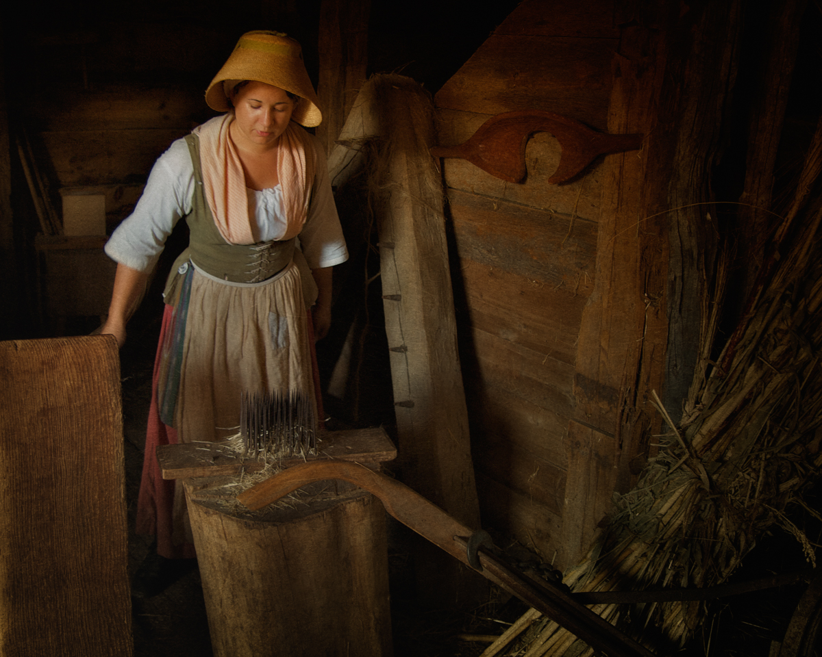Interpreter Heckling Flax at Philipsburg Manor