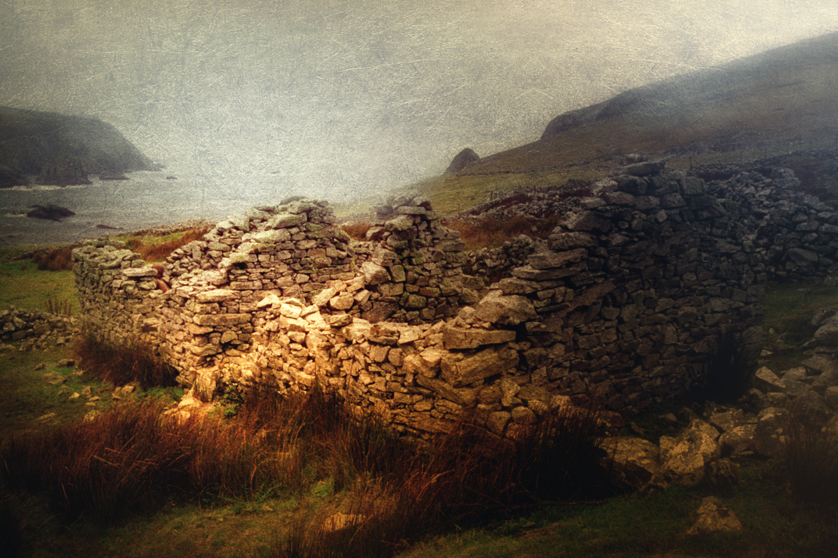 Photo of The cottages of the abandoned village of Port, in Donegal, Ireland in the rain